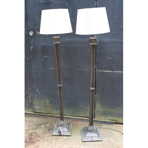 69 - Two metal standard lamps measures approx. 135cm tall (trade/spares/repairs)