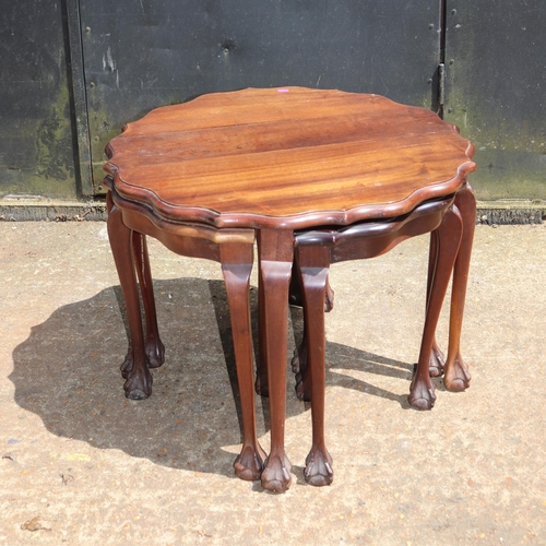 115 - Mahogany circular table with four pull out quarter side tables measures approx. 66cm dia