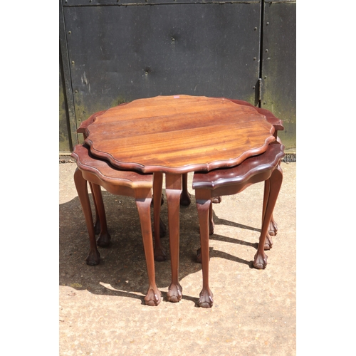 115 - Mahogany circular table with four pull out quarter side tables measures approx. 66cm dia