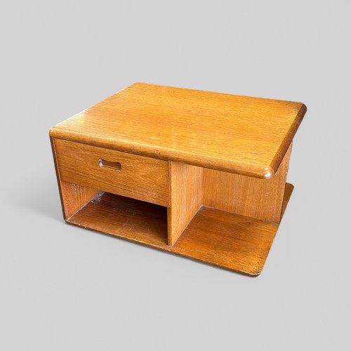 145 - Oak coffee table on castors fitted drawer one side and bureau front the other measures approx. 74cmW... 