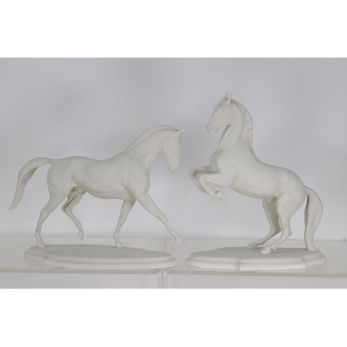 83A - A pair of Franklin Mint bisque porcelain horses by Pamela de Boulay; 