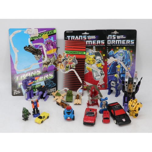 54 - Transformers Flame Feather, Guzle, Shockwave and a micromaster pack and a bag of other transformers ... 