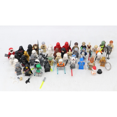 73 - A large quantity of mixed Star Wars lego mini figures and some accessories, unchecked for completene... 