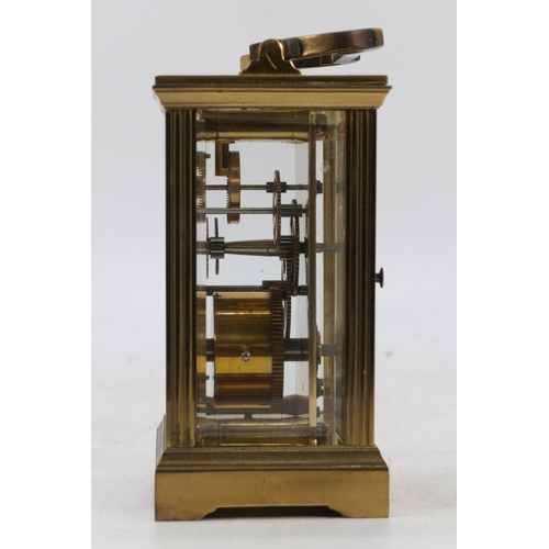 87 - Brass cased carriage clock with visible escapement, no key