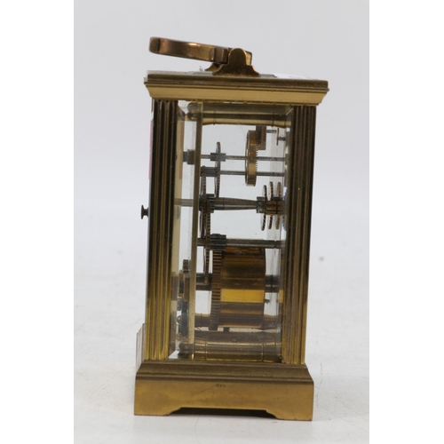 87 - Brass cased carriage clock with visible escapement, no key