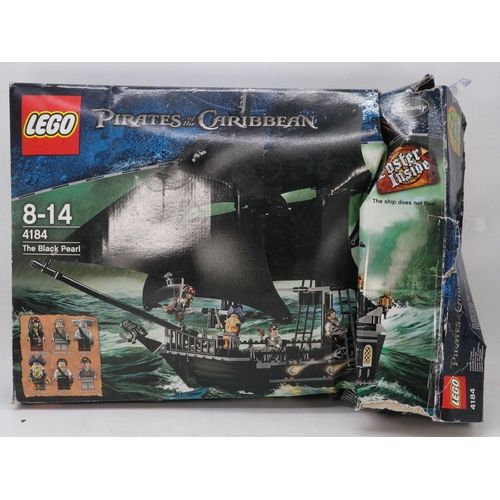 142 - Boxed Lego Pirates of the Caribbean The Black Pearl 4184, partly made, minifigures present, unchecke... 