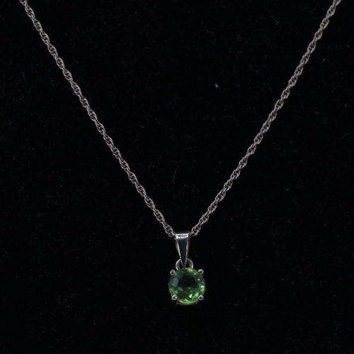 170 - 9ct Gold fine chain necklace with 750 pendant set with a green stone approx. 2.8g