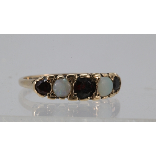 182 - 9ct gold Opal and garnet dress ring.