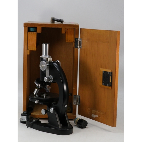 277 - Cased microscope L201 with fittings and key