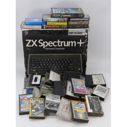 545 - A ZX Spectrum personal computer together with an assortment of games and tapes