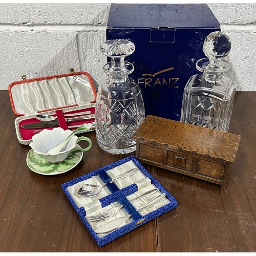 575 - Franz boxed cup, saucer and spoon together with two decanters, musical miniature coffer, christening... 