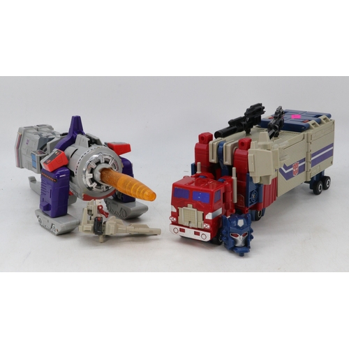 26 - Transformers Power Master Optimus Prime together with City Commander Galvatron both have original bo... 