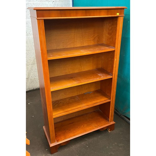 148 - Yew wood bookcase with adjustable shelves measures approx. 77cmW x 30cmD x 132cmH