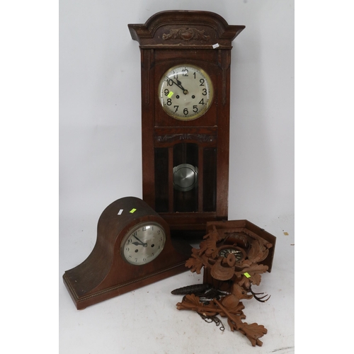 375 - A large oak cased wall clock together with a Napoleon hat mantle clock and a Black Forest style cuck... 