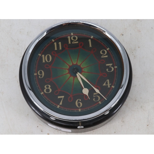 40 - English made clockwork clock with hand painted face measures approx. 18cm diameter