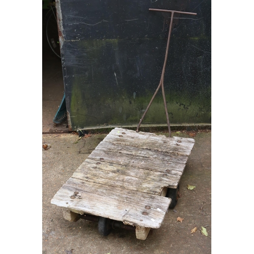 46 - A vintage wooden plank topped trolley with detachable cast iron handle (noted planks are dried and f... 