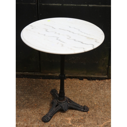 47 - Marble topped circular table on cast base measures approx. 60cm diameter