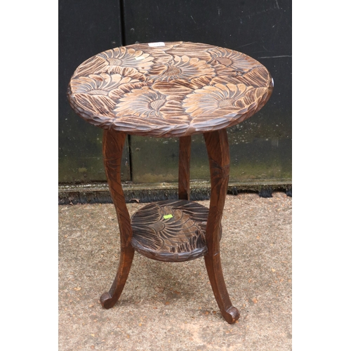 173 - A floral carved two tier table