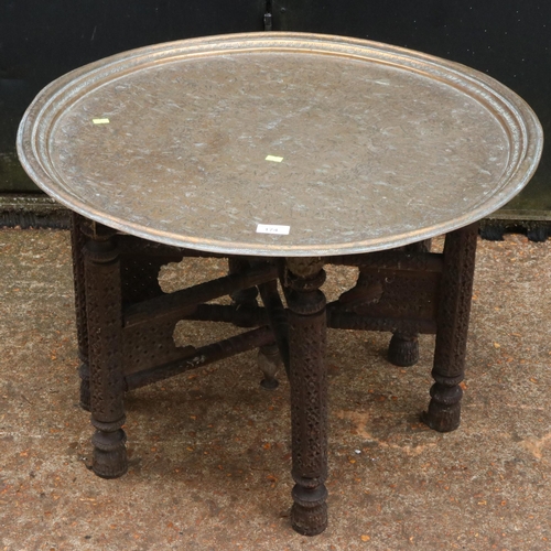 174 - A vintage folding tiffin table with large circular brass top