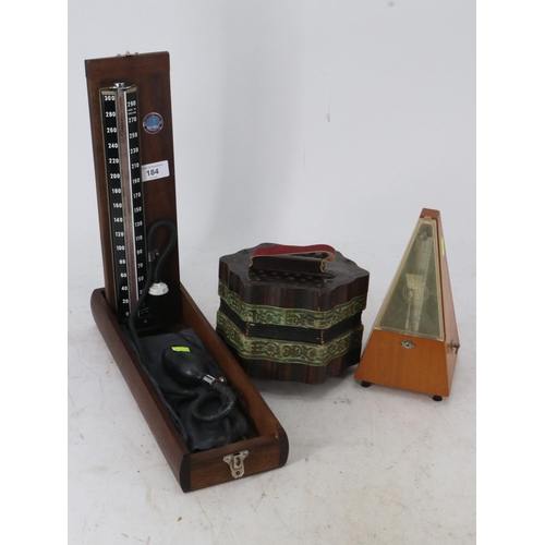 184 - Vintage cased blood pressure monitor together with a metronome, and an antique squeeze box