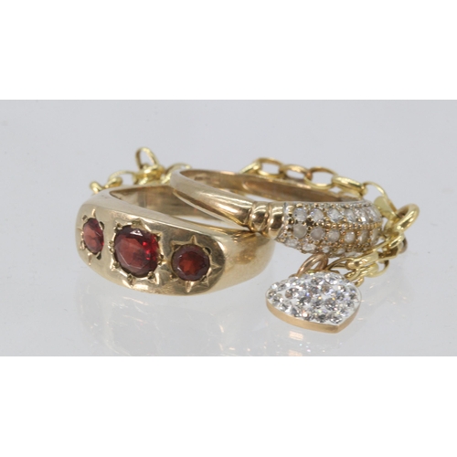 194 - 9ct gold dress ring, 9ct gold ring set with three garnets and a delicate 9ct gold bracelet with hear... 