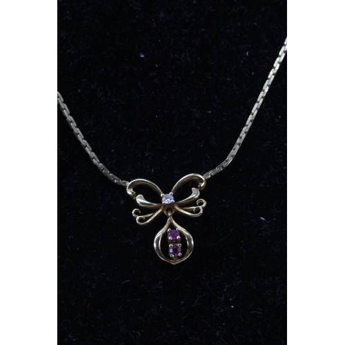 211 - 9ct gold neck chain with amethyst and diamonds?