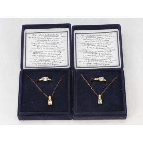 237 - Two boxed topaz ring and pendant sets