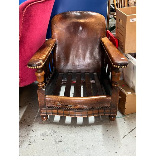 358 - A 1930's low club elbow chair, no cushion, leather upholstered rests and back