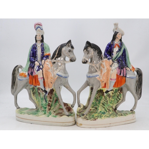 386 - Pair of antique Staffordshire figures on horseback Scottish with draping game over the horse (approx... 