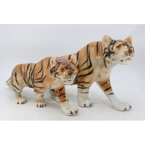 398 - Two Royal Dux Tigers in two heights, largest measures approx. 54cm length and 45cm length