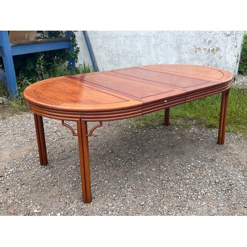 463 - Chinese hardwood dining table, extending with two additional leaves.