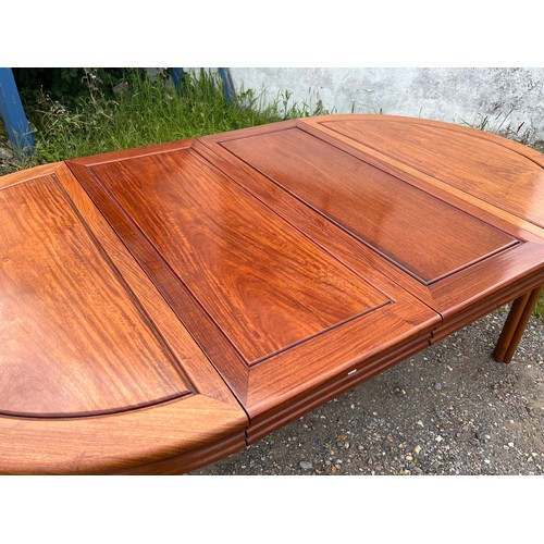 463 - Chinese hardwood dining table, extending with two additional leaves.