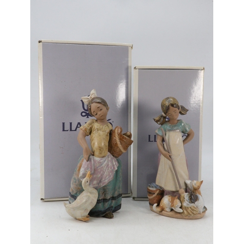 558 - Two boxed  Lladro figures 