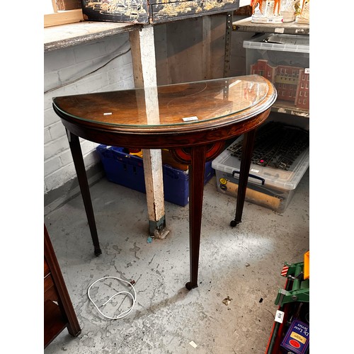 503 - A half moon occasional table with glass top