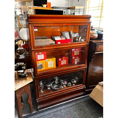 364 - A Globe Wernicke style three section bookcase with lift over glazed doors (measures approx. L86.5cm ... 