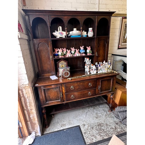 535 - Oak dresser with fitted 2 central drawers to base with cupboard either side, raised top with two cup... 