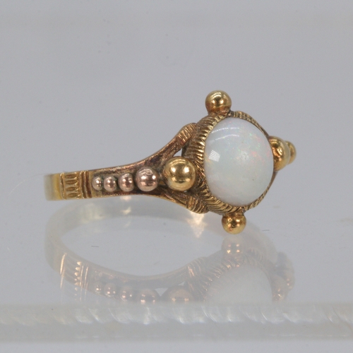 188 - Antique gold ring set with a centre opal.