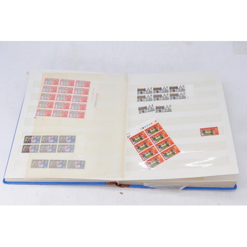 488 - A stamp album containing mint GB stamps together with a Windsor Great Britain album - mainly empty