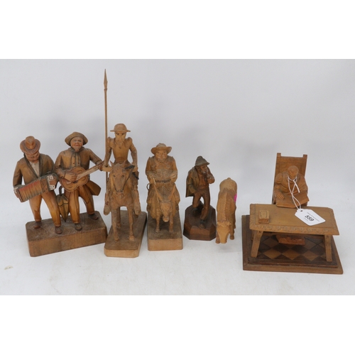 559 - Wooden figures to incude Sancho Panchez, Don Quixote, donkey, pair of minstrels on plinth, man with ... 