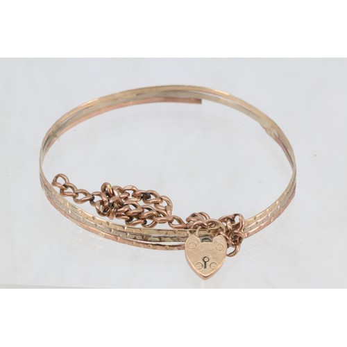 198 - 9ct gold charm link bracelet with padlock clasp together with yellow metal bangle both a/f, total ap... 