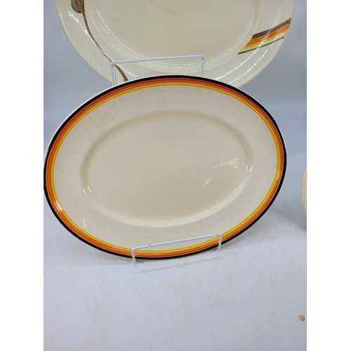 456 - Two Clarice Cliff platters together with a smaller plate similar