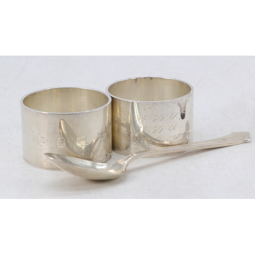 6 - Pair of Silver napkin rings together with a silver spoon (approx. 150g)