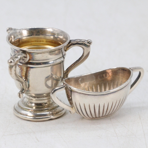 24 - Silver three handled trophy and miniature sugar bowl (weight approx. 10g)