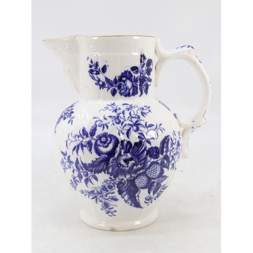 179 - A large Worcester water jug, decorated floral sprays and butterflies, crescent mark to base