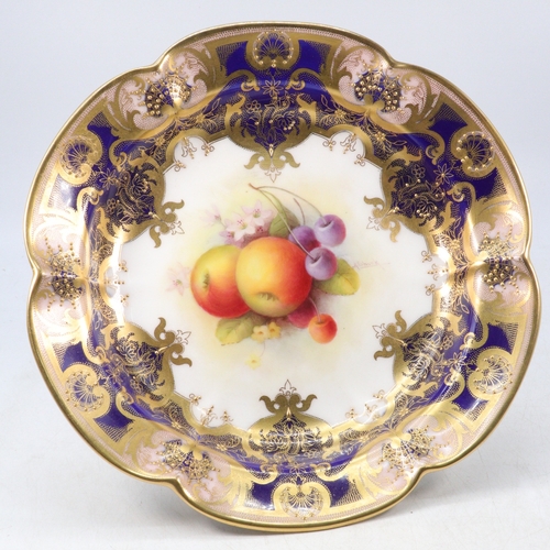 134 - Royal Worcester comport, centre painted with fruit by A Shuck with blue and gilt border, puce mark t... 