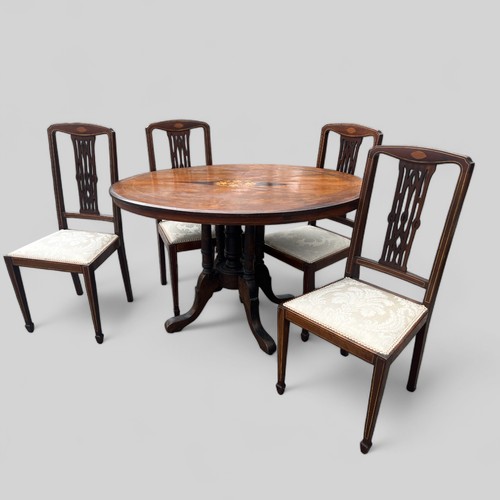 590 - Victorian oval tilt top table together with four mahogany chairs