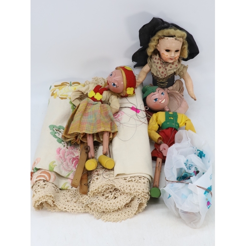 578 - Two vintage pelham puppets together with an Antique doll and a vintage table cloth.