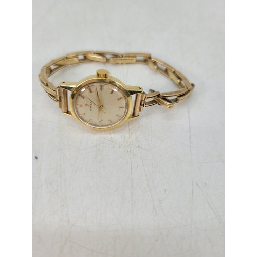 205A - Ladies Omega 9ct gold cased wristwatch and 9ct gold strap.