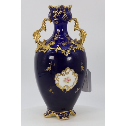 64 - Royal Crown Derby twin handled vase on colbalt blue ground with raised gilt decoration with floral l... 