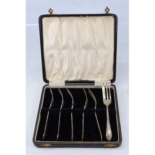 28A - A cased set of six silver pastry forks